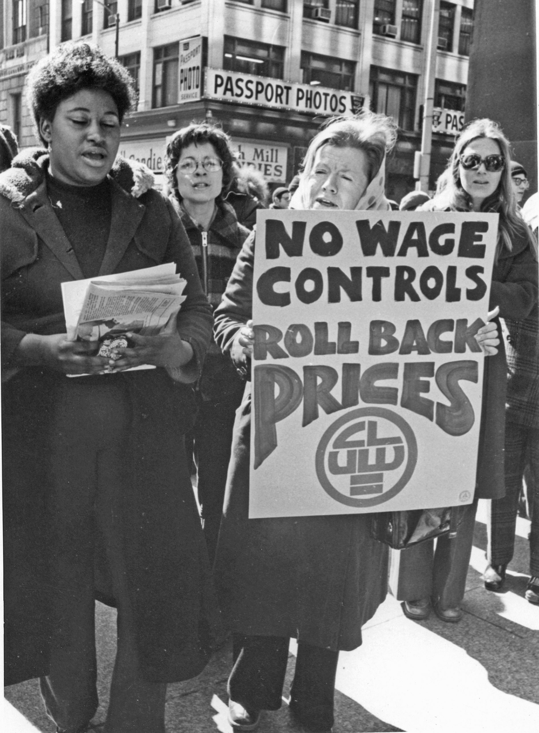 Group of Coalition of Labor Union Women picketers one holds a sign that reads No Wage Controls, Roll Back Prices