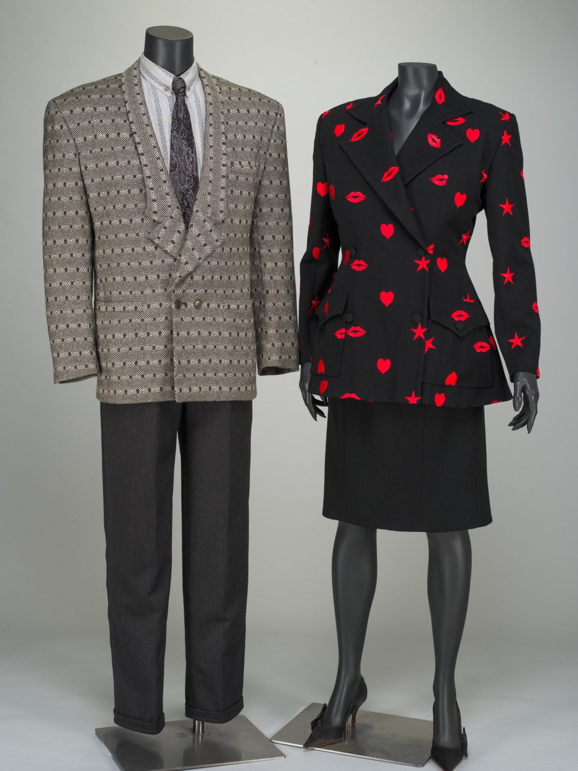 Women’s suit by Patrick Kelly; Men’s suit ensemble by Gianni Versace