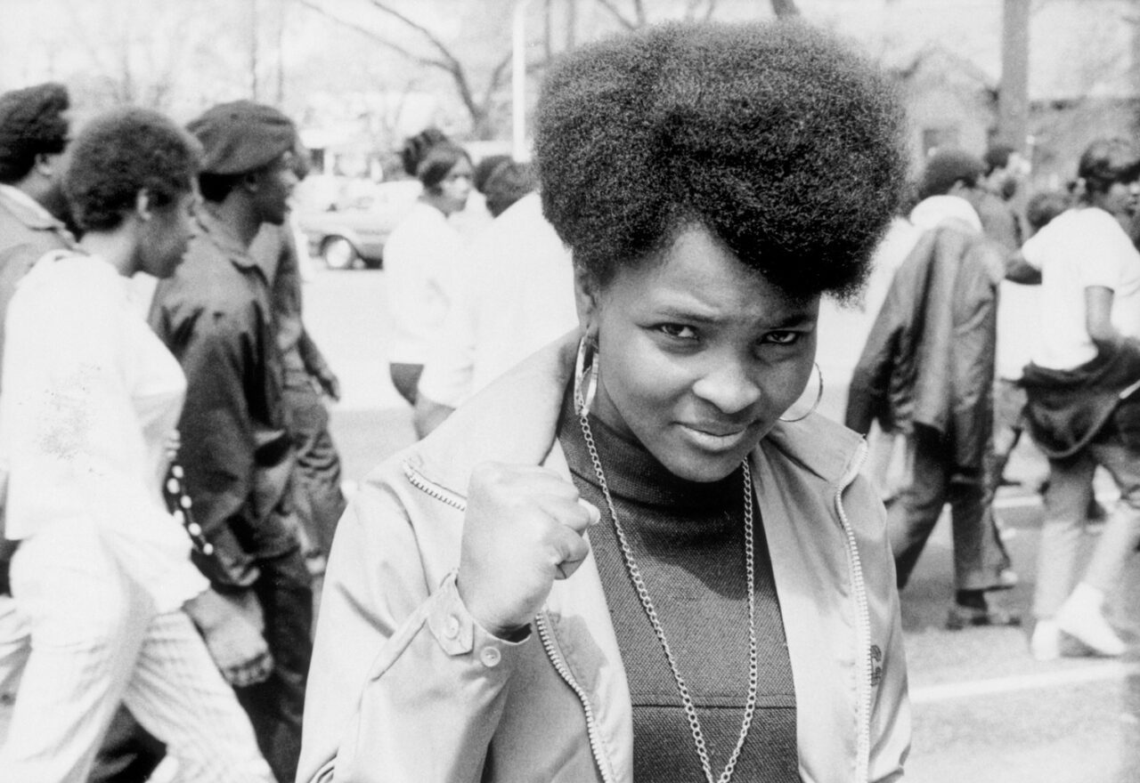 Woman raises her fist during Chicago Martin Luther King Jr. rally